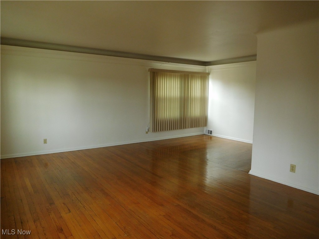 13698 Cedar Road Cleveland, OH 44118 - Photo 12 of 33 Spare room with wood-type flooring and baseboards