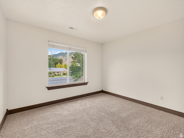 1279 West 1500th Street North Mapleton, UT 84664 - Photo 35 of 83 Neutral-toned carpeting paired with white walls and dark wood-finish trim