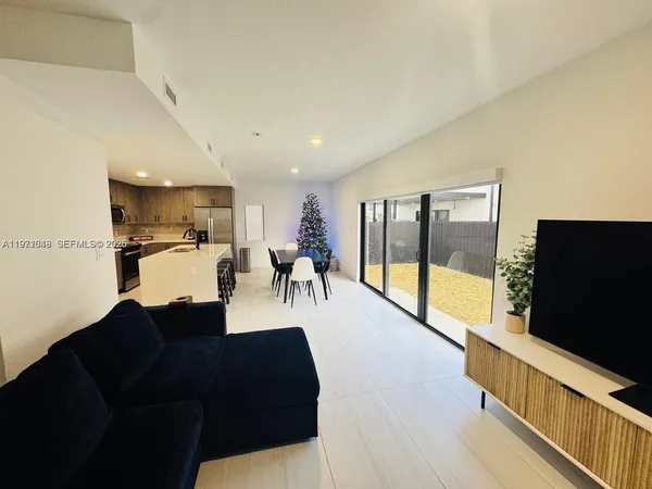 a kitchen with a table and chairs in it