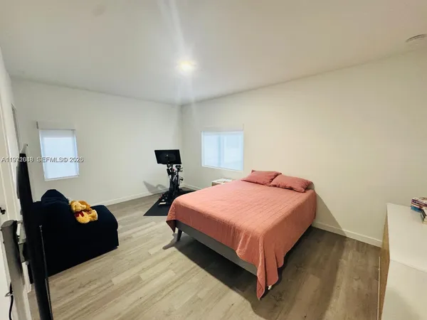 a bathroom with a shower and a tub