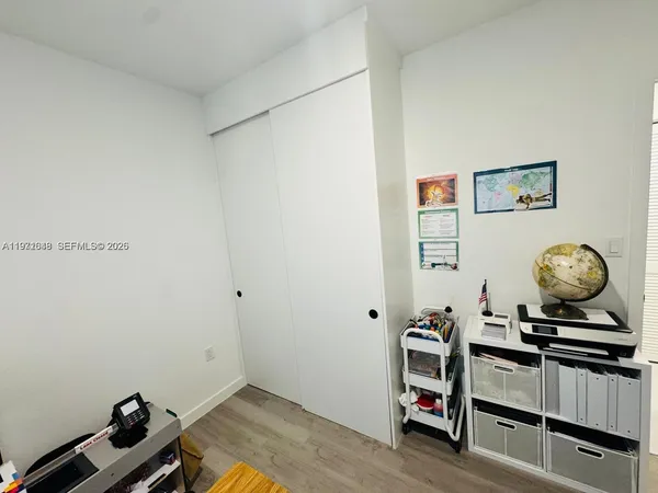 a lobby with furniture and flat screen tv