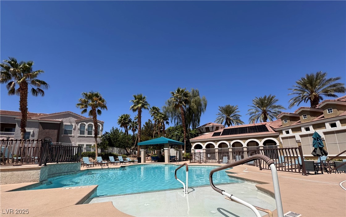 9975 Peace Way, Unit 1140 Las Vegas, NV 89147 - Photo 23 of 23 Pool with a patio and fence