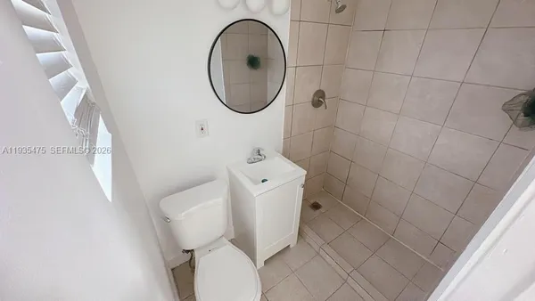 a bathroom with a toilet and a sink