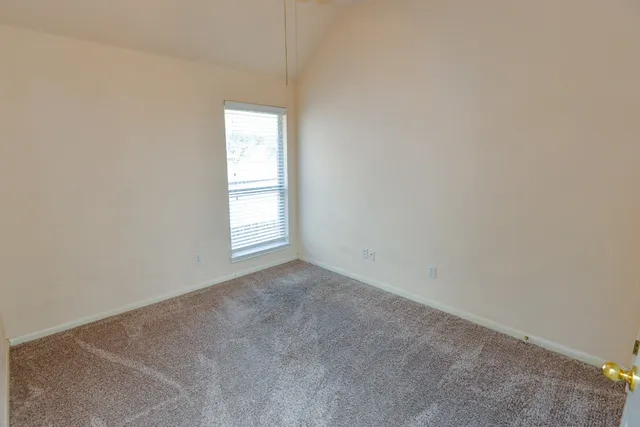 a spacious bathroom with a tub sink and shower