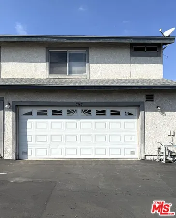 a view of swimming pool with outdoor seating and covered with trees