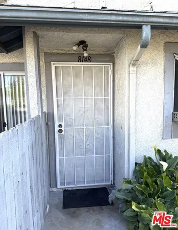 a view of a door and a window