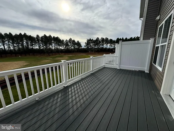 a view of balcony with wooden floor