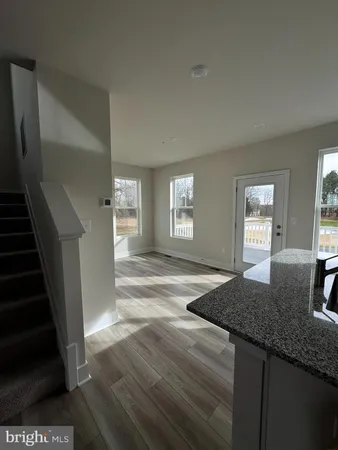 a view of a kitchen cabinets and wooden floor