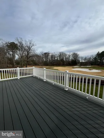 a view of a balcony with wooden floor