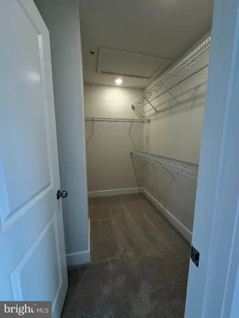 a view of wooden floor and windows in a room