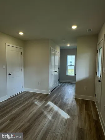 a view of an empty room with windows