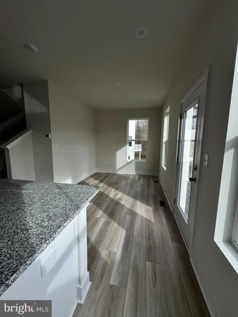 a view of a kitchen from the hallway