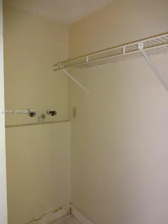 a view of a room with racks on the wall