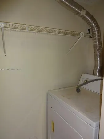 a kitchen with stainless steel appliances granite countertop a refrigerator stove and sink