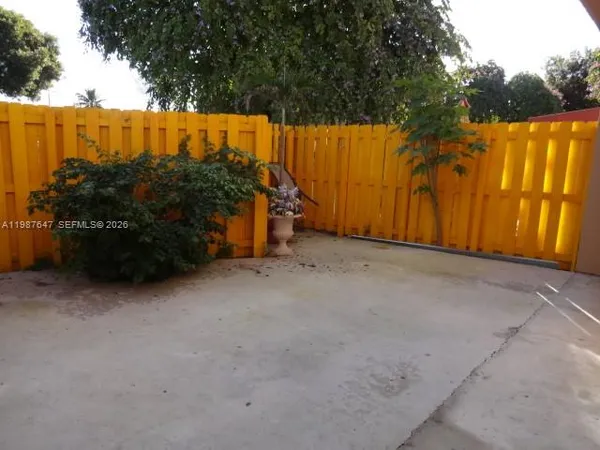 a view of backyard and tree