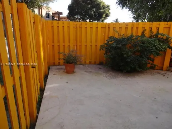 a view of a back yard of the house