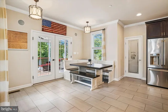 a view of kitchen island with furniture and windows