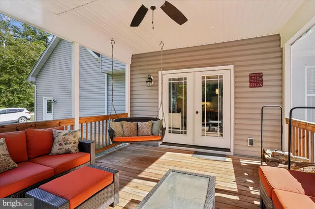 a view of a kitchen with white cabinets