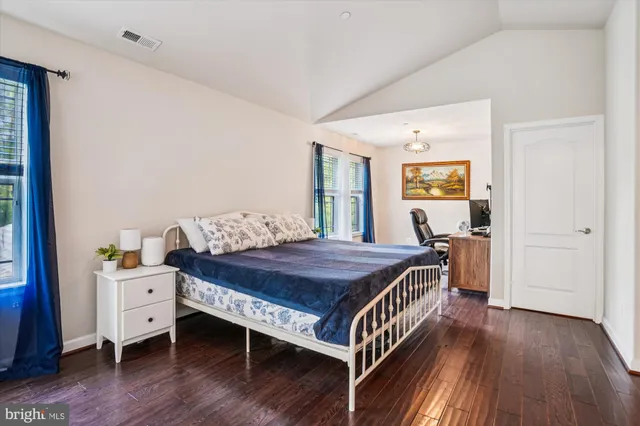 a bedroom with a workspace