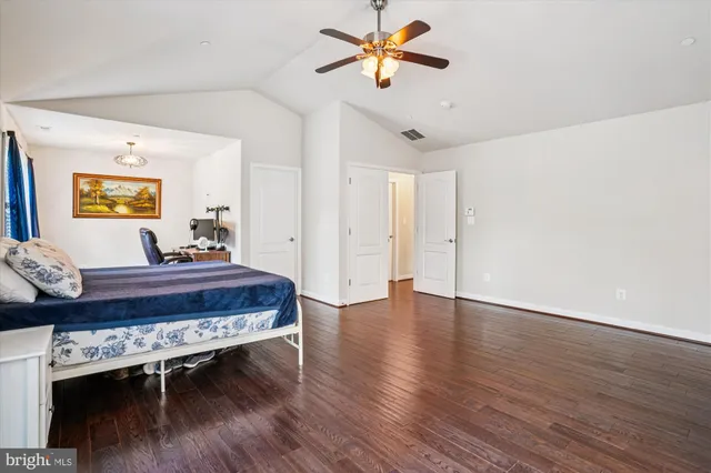 a view of walk in closet with clothes