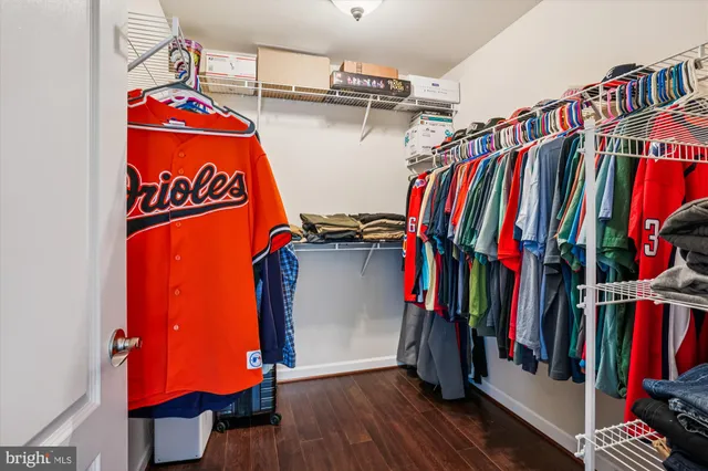 a bathroom with a bathtub a double vanity sink and mirror