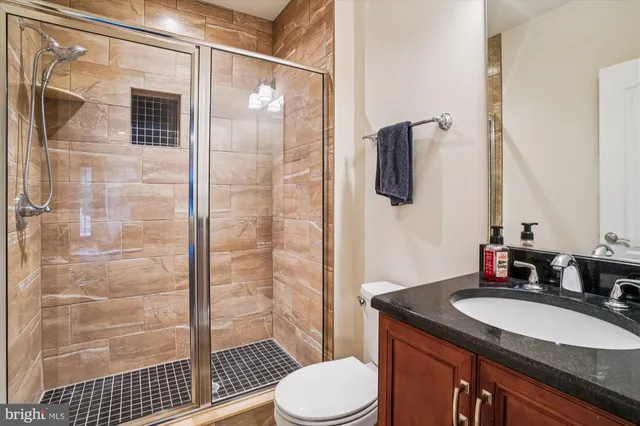 a patio with a table and chairs under an umbrella