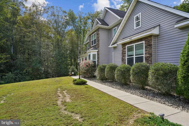 a front view of a house with outdoor seating