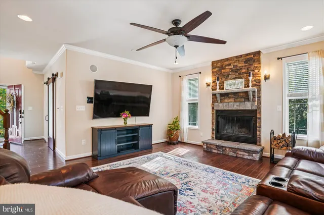 a bed room with furniture and a flat screen tv
