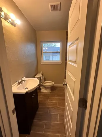 a bathroom with a toilet and a tub