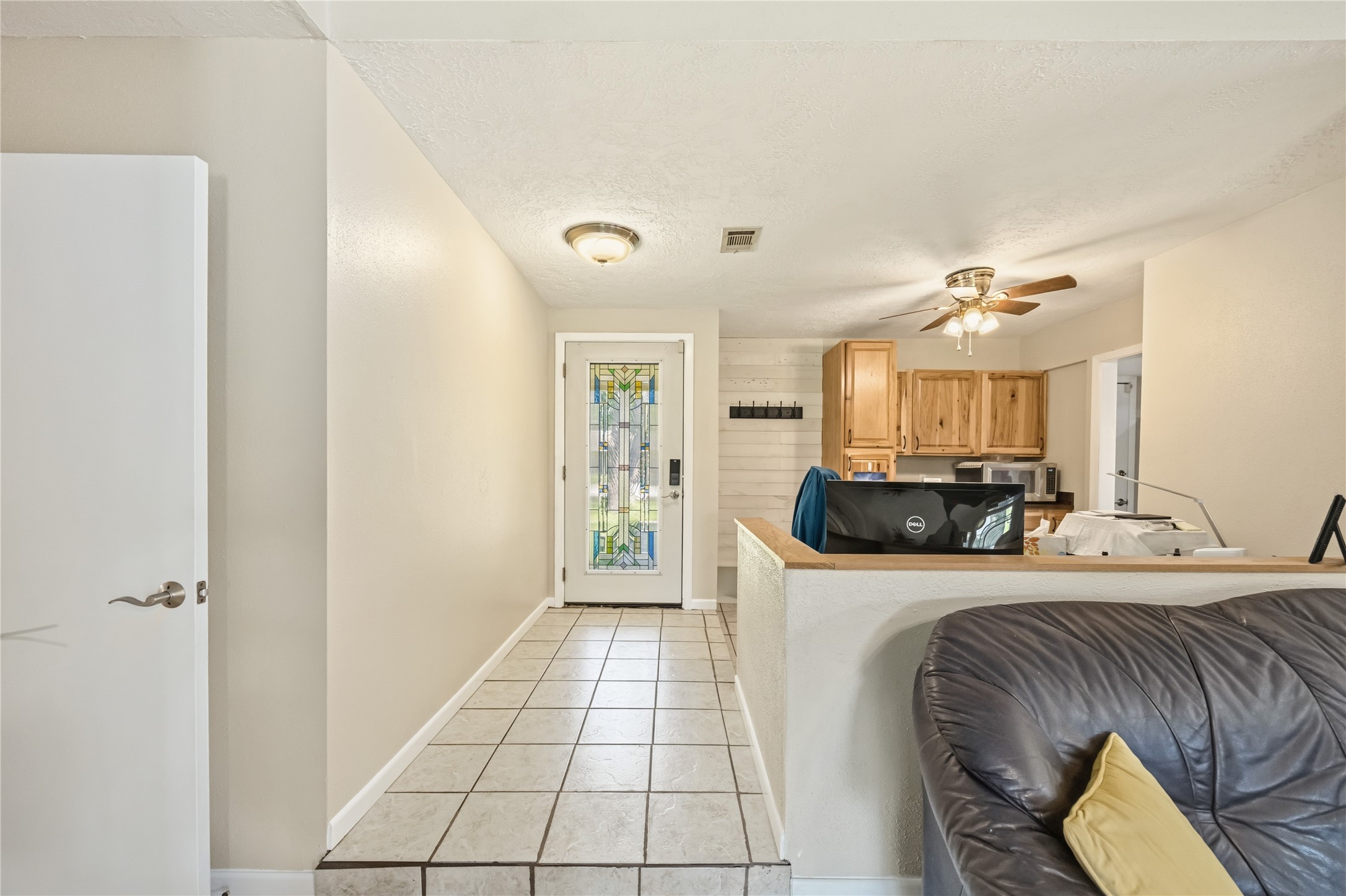 9635 Birsay Street Spring, TX 77379 - Photo 5 of 24 a kitchen with stainless steel appliances granite countertop a sink and a refrigerator