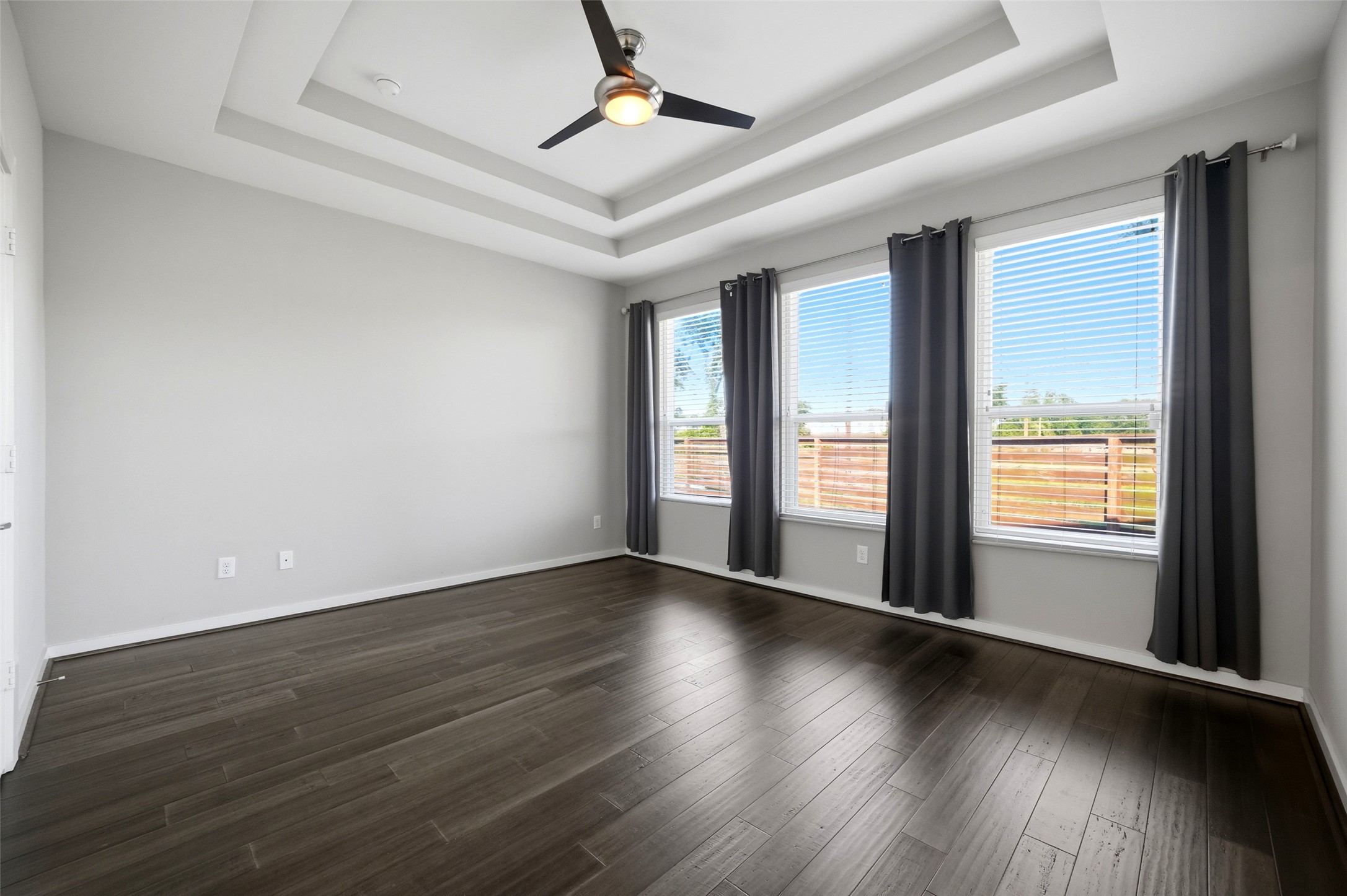 605 Dumble Street Houston, TX 77023 - Photo 24 of 44 a view of an empty room with wooden floor and a window