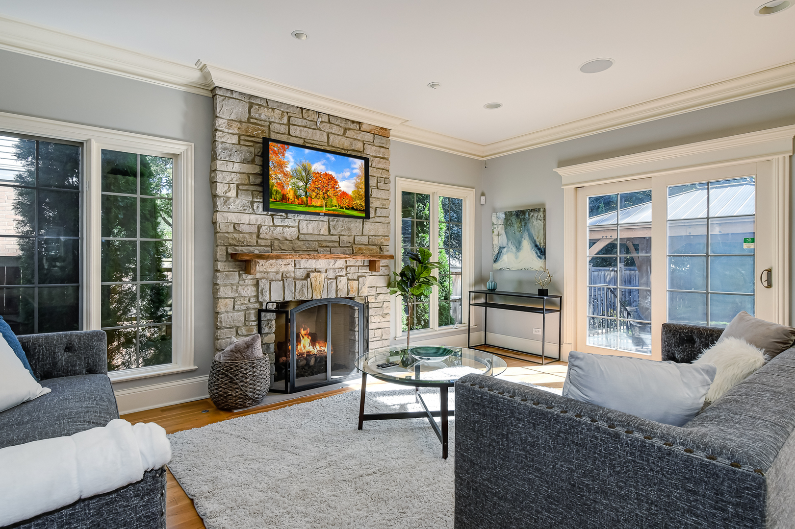 621 North County Line Road Hinsdale, IL 60521 - Photo 14 of 48 a living room with furniture a flat screen tv and a fireplace