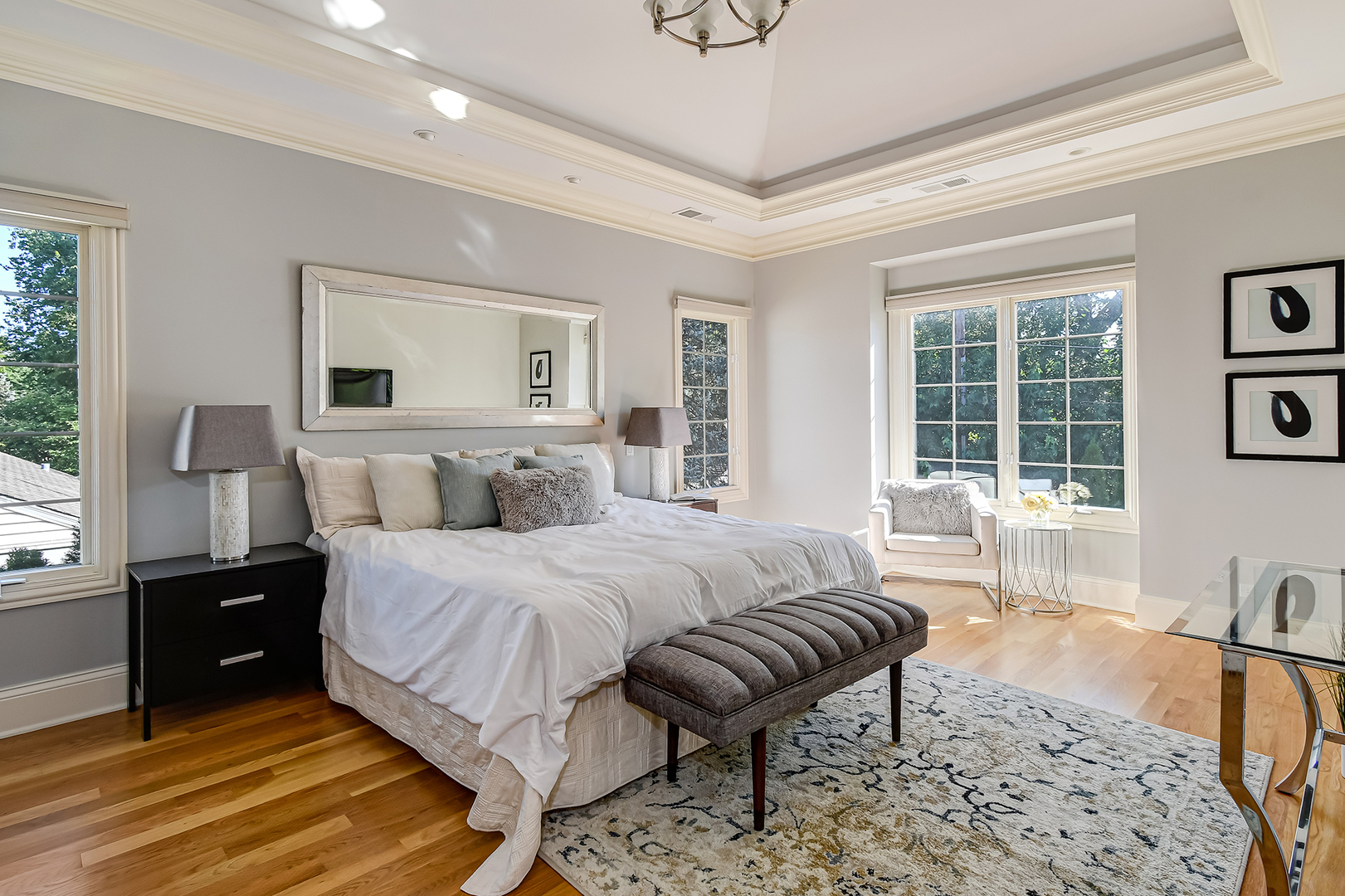 621 North County Line Road Hinsdale, IL 60521 - Photo 18 of 48 a spacious bedroom with a bed a couch and large window with outer view