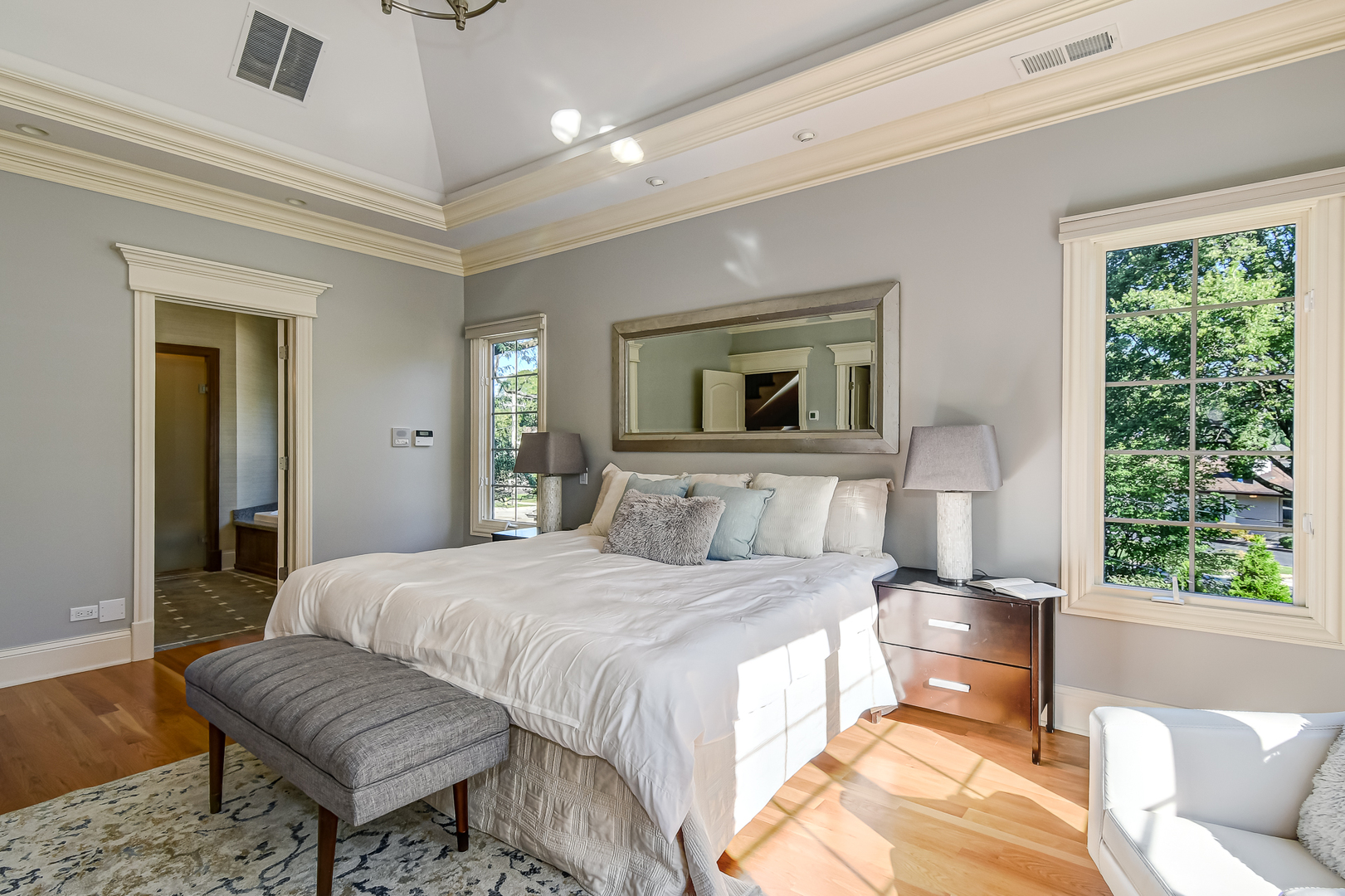 621 North County Line Road Hinsdale, IL 60521 - Photo 19 of 48 a bedroom with a large bed and a couch