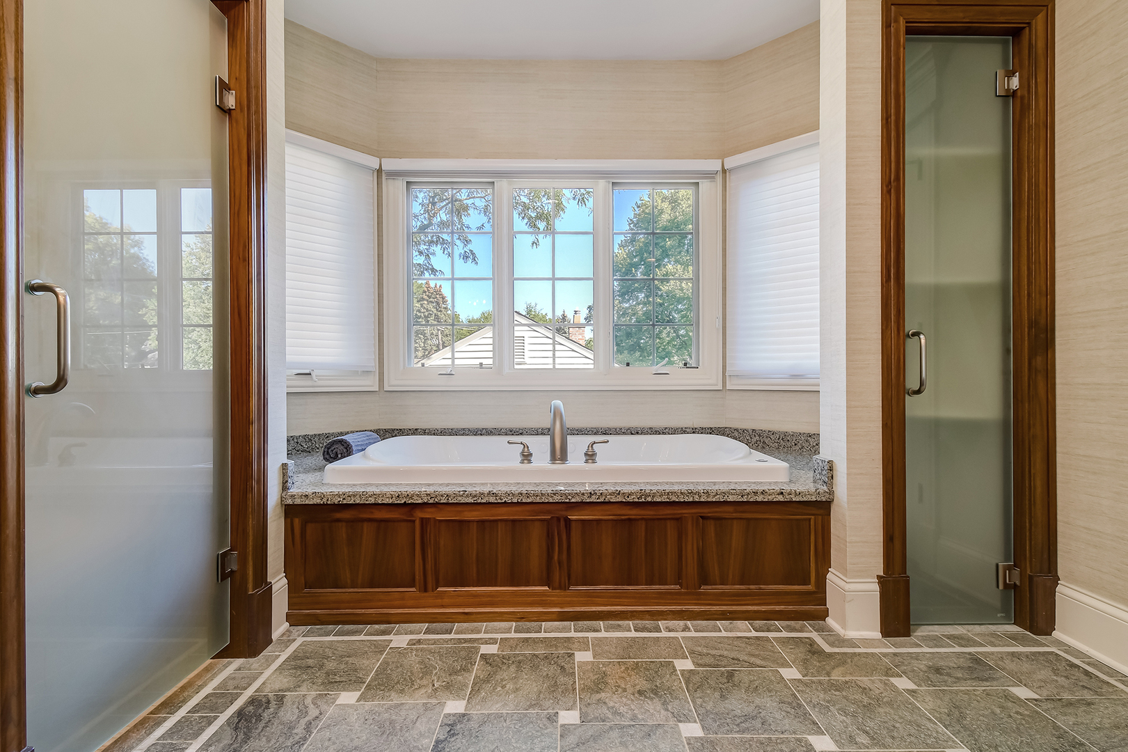 621 North County Line Road Hinsdale, IL 60521 - Photo 20 of 48 a bathroom with a tub shower and a sink