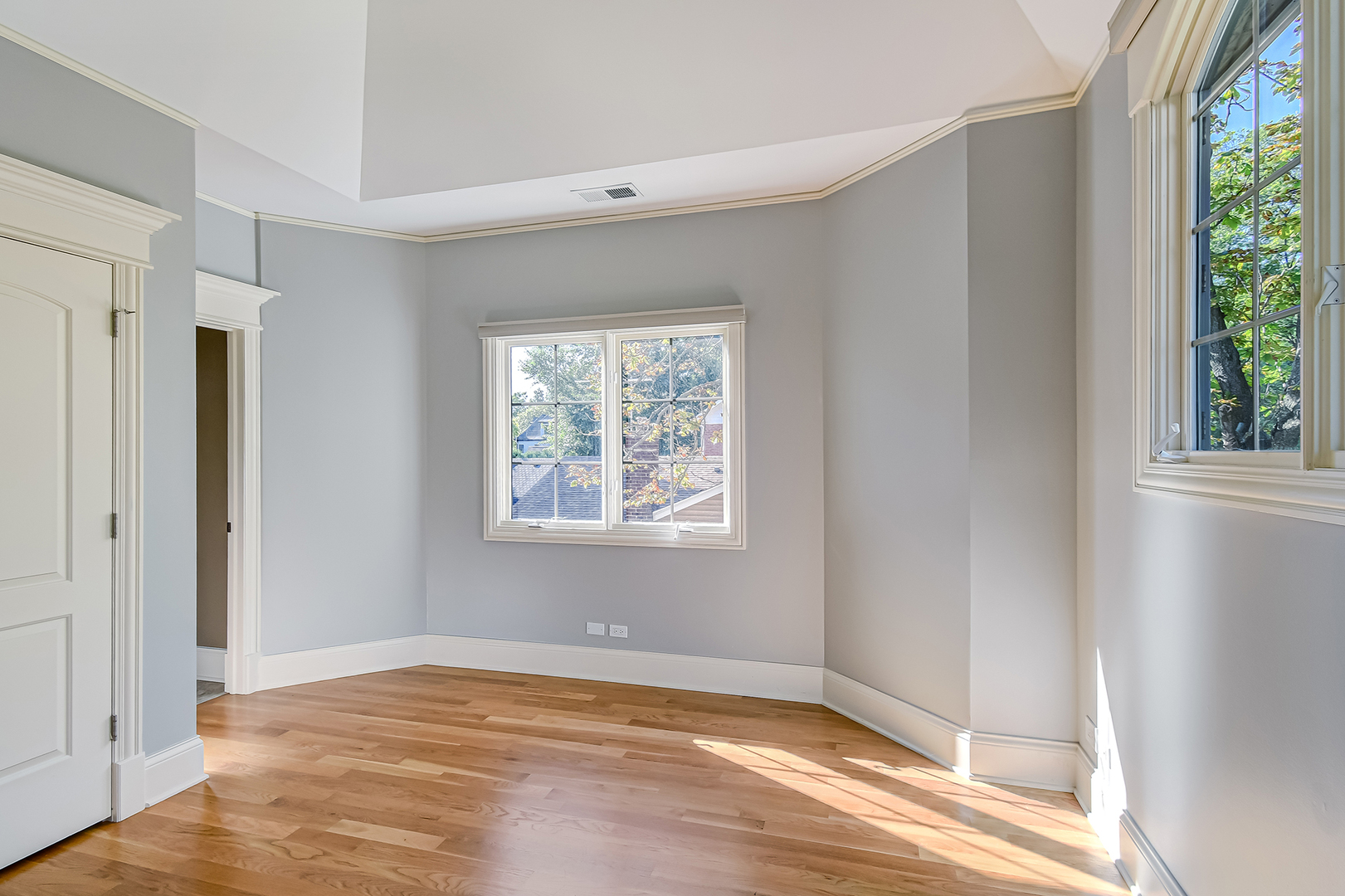 621 North County Line Road Hinsdale, IL 60521 - Photo 24 of 48 a view of an empty room with wooden floor and a window
