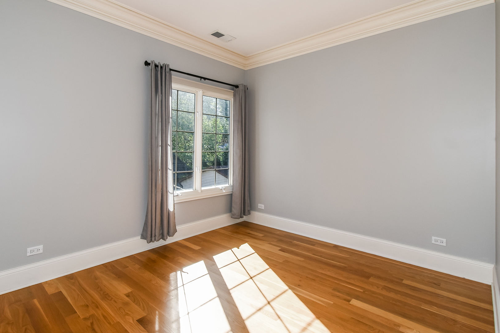 621 North County Line Road Hinsdale, IL 60521 - Photo 26 of 48 a view of a room with wooden floor and natural light