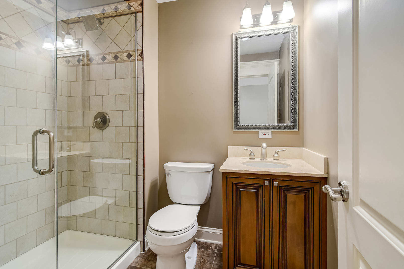 621 North County Line Road Hinsdale, IL 60521 - Photo 30 of 48 a bathroom with a sink toilet and shower