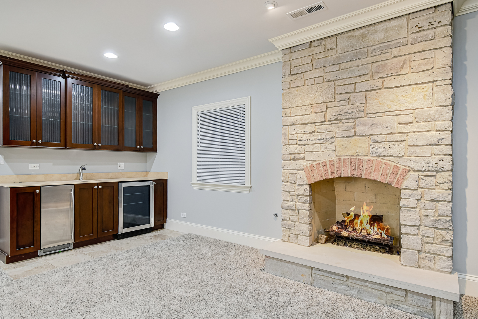 621 North County Line Road Hinsdale, IL 60521 - Photo 33 of 48 a hallway with fireplace and a cabinet