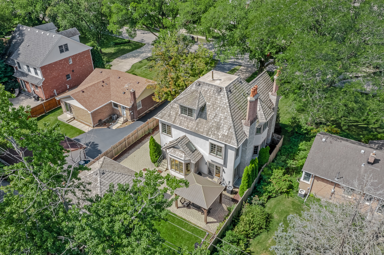 621 North County Line Road Hinsdale, IL 60521 - Photo 42 of 48 an aerial view of a house with a yard and trees
