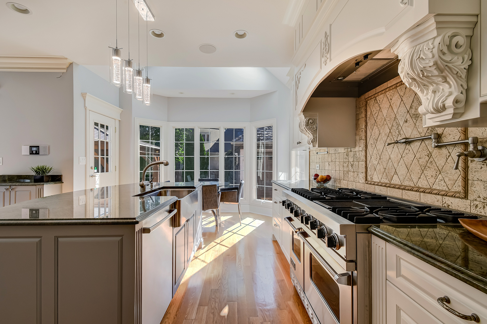 621 North County Line Road Hinsdale, IL 60521 - Photo 10 of 48 a kitchen with a stove a sink a refrigerator and window