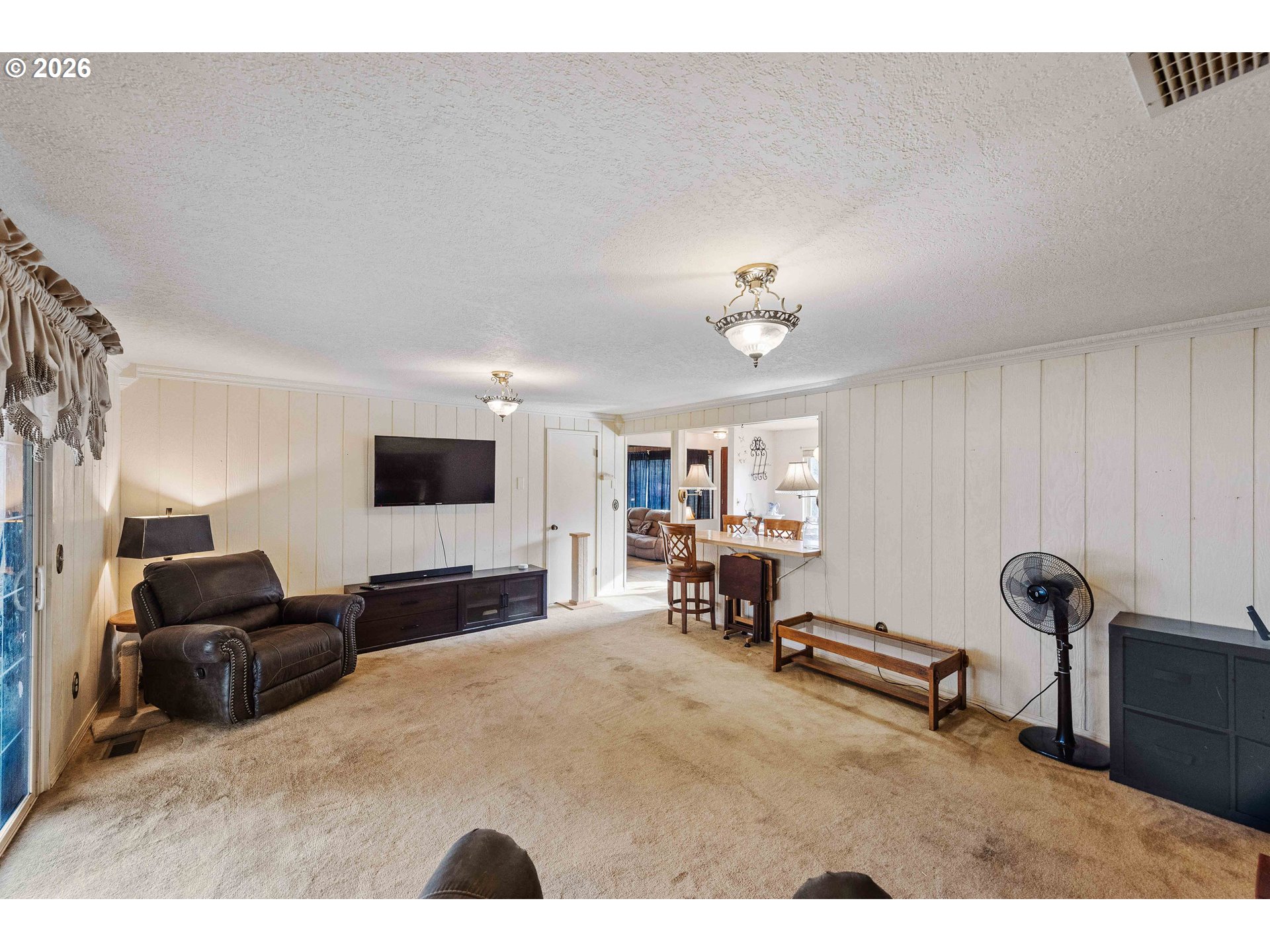2031 Kincheloe Lane Myrtle Point, OR 97458 - Photo 15 of 33 a living room with furniture and a flat screen tv