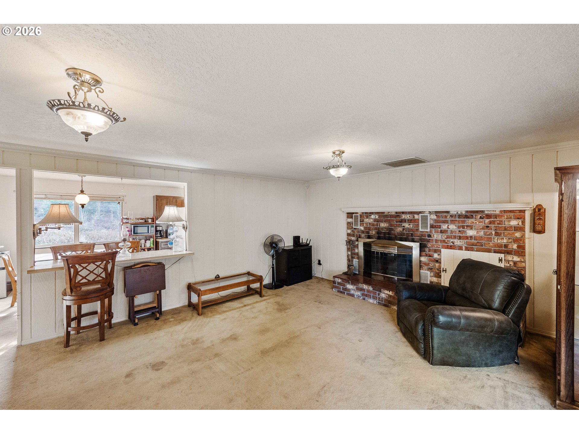2031 Kincheloe Lane Myrtle Point, OR 97458 - Photo 16 of 33 a living room with furniture a fireplace and a flat screen tv