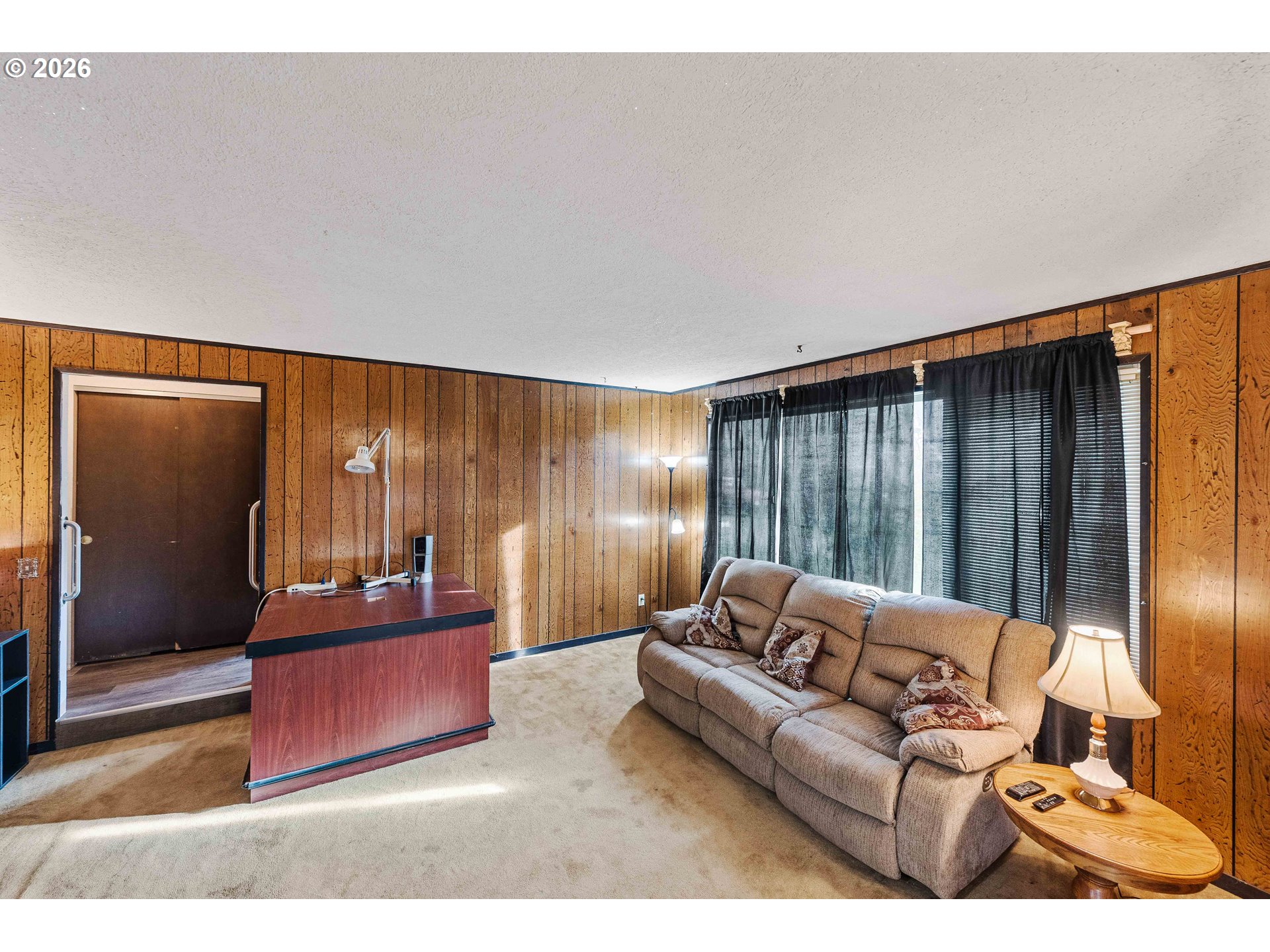 2031 Kincheloe Lane Myrtle Point, OR 97458 - Photo 17 of 33 a living room with furniture and a large window