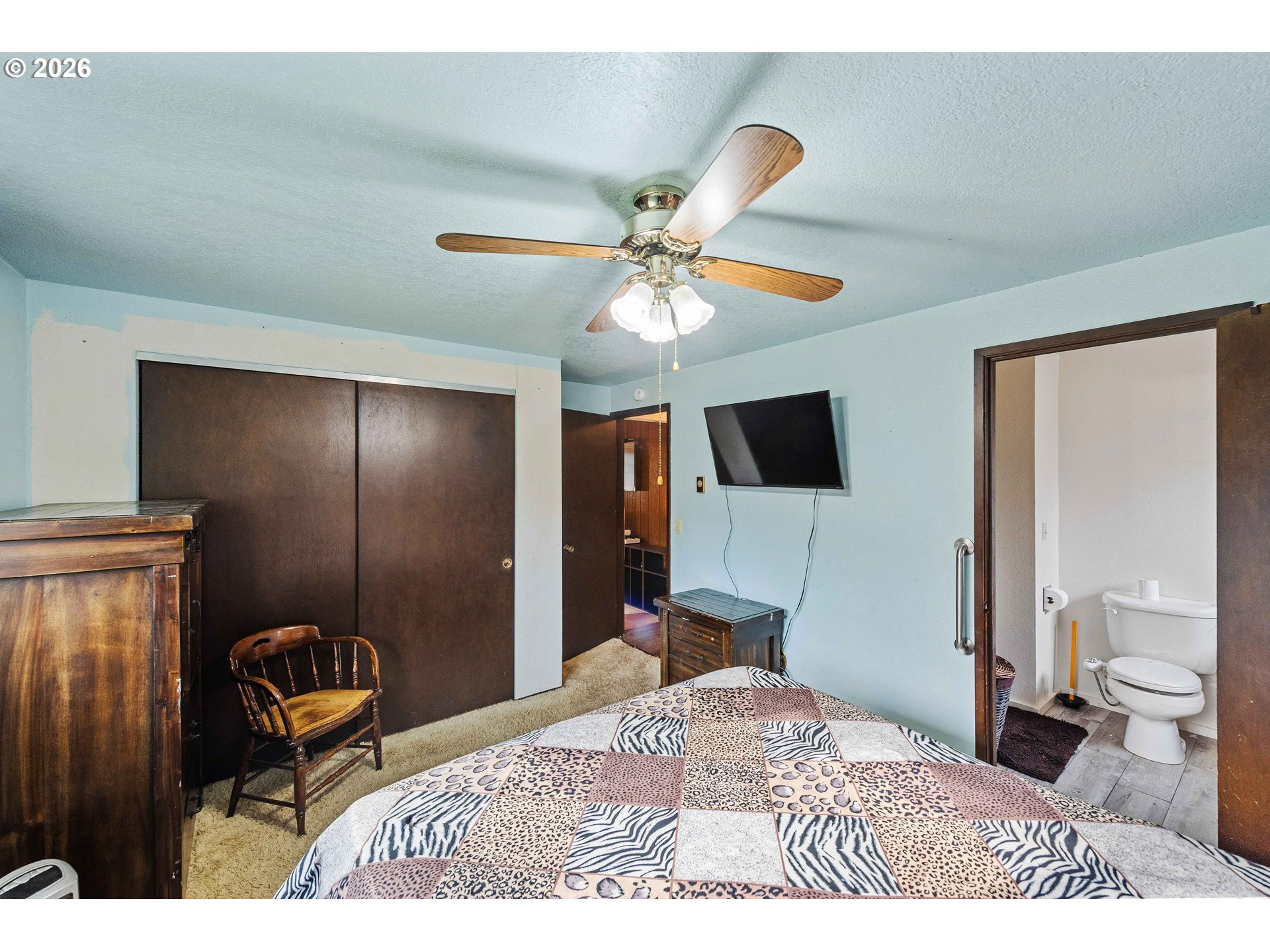 2031 Kincheloe Lane Myrtle Point, OR 97458 - Photo 20 of 33 a bedroom with a bed and a flat screen tv