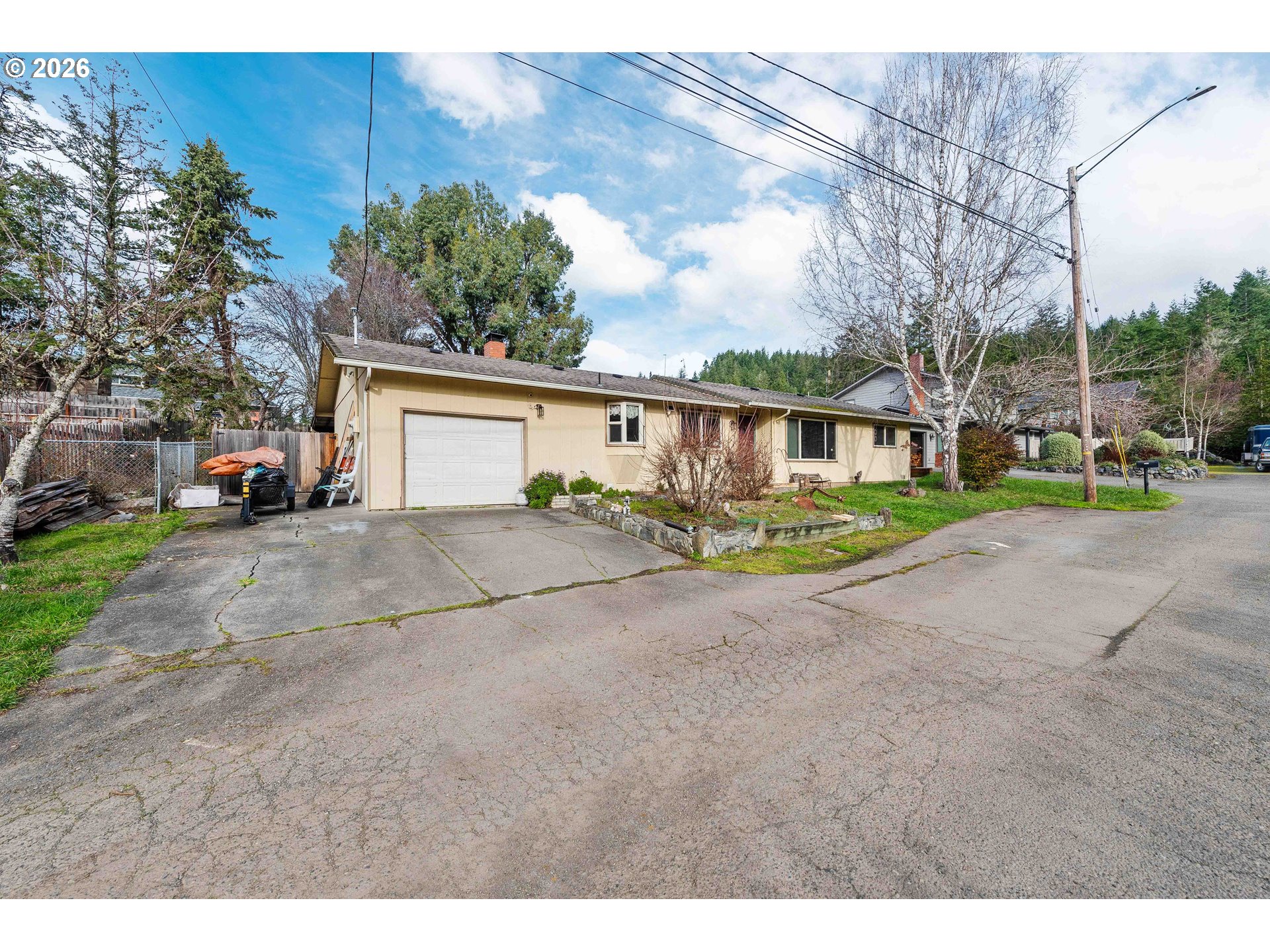 2031 Kincheloe Lane Myrtle Point, OR 97458 - Photo 2 of 33 a view of an house with outdoor space and street view