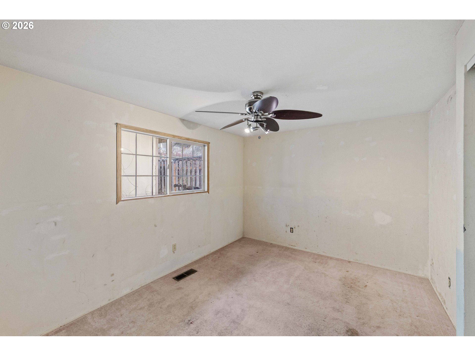2031 Kincheloe Lane Myrtle Point, OR 97458 - Photo 25 of 33 a view of an empty room with a window