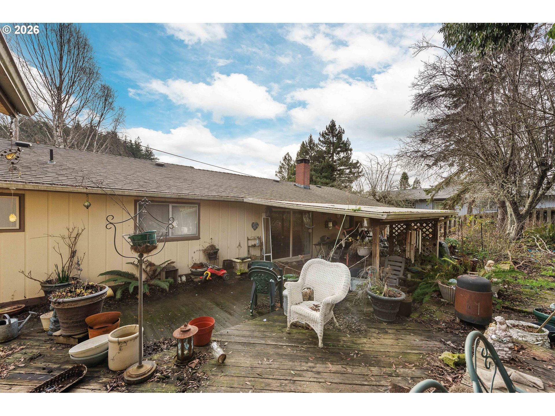 2031 Kincheloe Lane Myrtle Point, OR 97458 - Photo 29 of 33 a backyard of a house with table and chairs