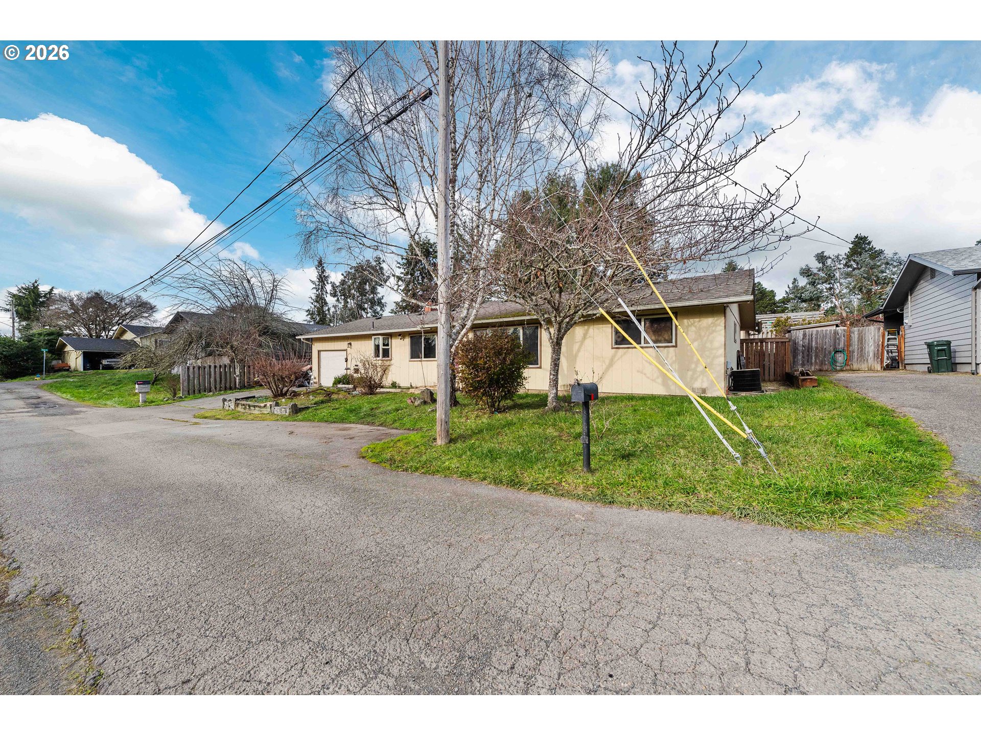 2031 Kincheloe Lane Myrtle Point, OR 97458 - Photo 3 of 33 a view of a house with a big yard and large tree