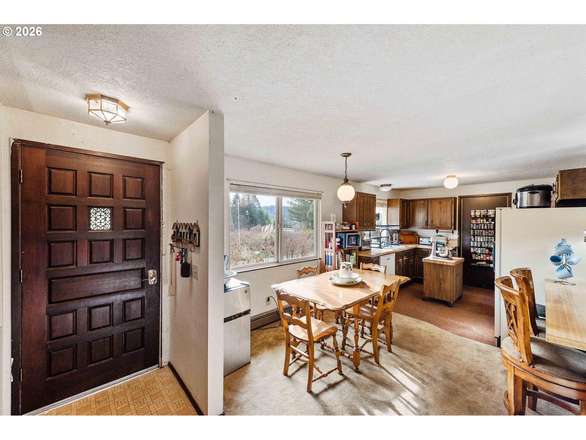 2031 Kincheloe Lane Myrtle Point, OR 97458 - Photo 8 of 33 a view of a dining room with furniture window and outside view
